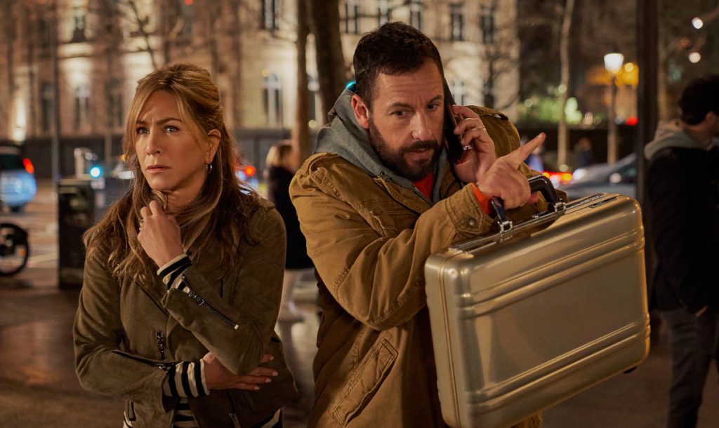 Murder Mystery 2. (L-R) Jennifer Aniston as Audrey Spitz and Adam Sandler as Nick Spitz in Murder Mystery 2. Cr. Scott Yamano/Netflix © 2022.