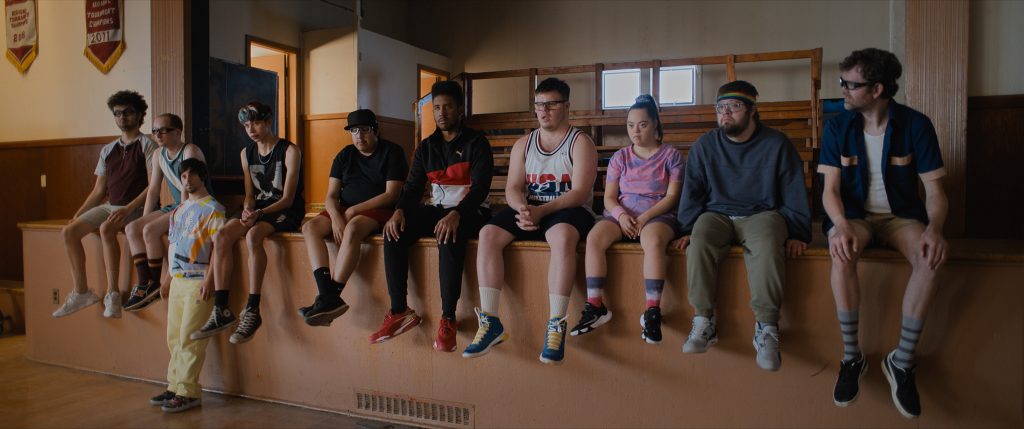 (L to R) Alex Hintz as Arthur, Casey Metcalfe as Marlon, Matthew von der Ahe as Craig, Ashton Gunning as Cody, Tom Sinclair as Blair, Joshua Felder as Darius, James Day Keith as Benny, Madison Tevlin as Cosentino, Kevin Iannucci as Johnathan, and Bradley Edens as Showtime in director Bobby Farrelly's CHAMPIONS, a Focus Features release. Credit : Courtesy of Focus Features