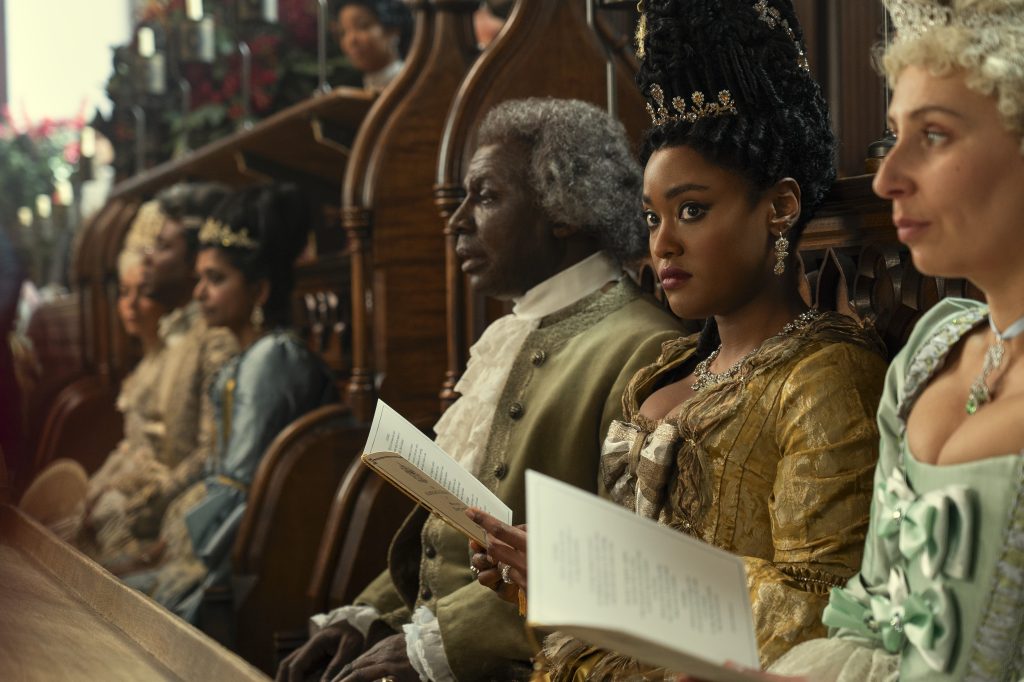 Queen Charlotte: A Bridgerton Story. (L to R) Cyril Nri as Lord Danbury, Arsema Thomas as Young Agatha Danbury in episode 101 of Queen Charlotte: A Bridgerton Story. Cr. Liam Daniel/Netflix © 2023