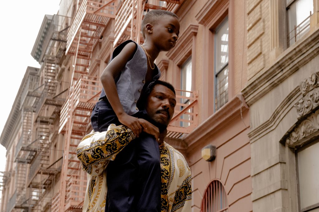 (L to R) Aaron Kingsley Adetola stars as six year old "Terry" and Will Catlett stars as "Lucky" in writer/director A.V. Rockwell's A THOUSAND AND ONE, released by Focus Features. Courtesy of Aaron Ricketts/Focus Features.