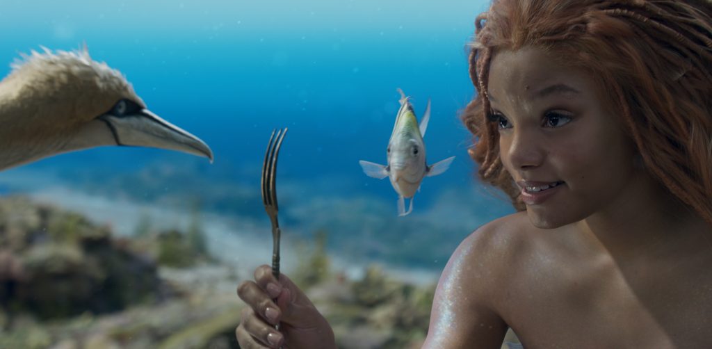 (L-R): Scuttle (voiced by Awkwafina), Flounder (voiced by Jacob Tremblay), and Halle Bailey as Ariel in Disney's live-action THE LITTLE MERMAID. Photo courtesy of Disney. © 2023 Disney Enterprises, Inc. All Rights Reserved.