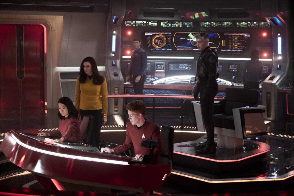 L-R Rong Fu as Mitchell, Rebecca Romijn as Una, Ethan Peck as Spock and Anson Mount as Capt. Pike in Star Trek: Strange New Worlds streaming on Paramount+, 2023. Photo Credit: Michael Gibson/Paramount+