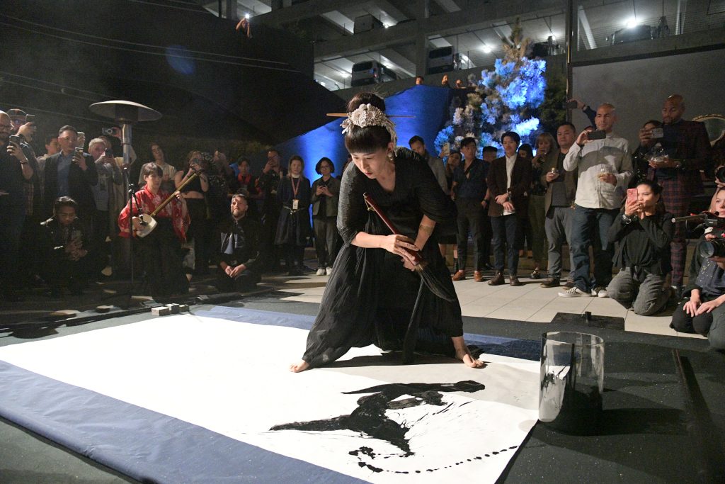 LOS ANGELES, CALIFORNIA - NOVEMBER 01: An artist paints during Netflix's "Blue Eye Samurai" LA Tastemaker at the Japanese American National Museum on November 01, 2023 in Los Angeles, California. (Photo by Charley Gallay/Getty Images for Netflix)