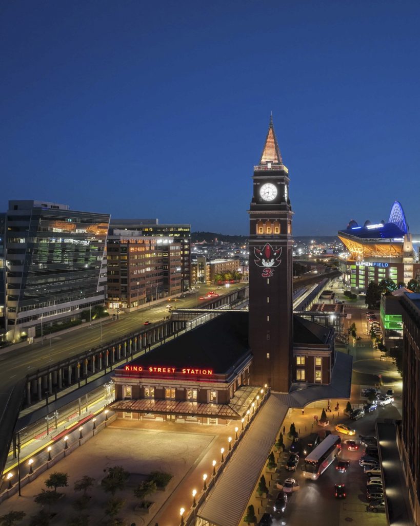 Sonic the Hedgehog 3 projections featuring images of Sonic, Shadow, and the classic Robotnik icon appear in multiple cities and locations around the world, as seen here at the King Street Station, Seattle.