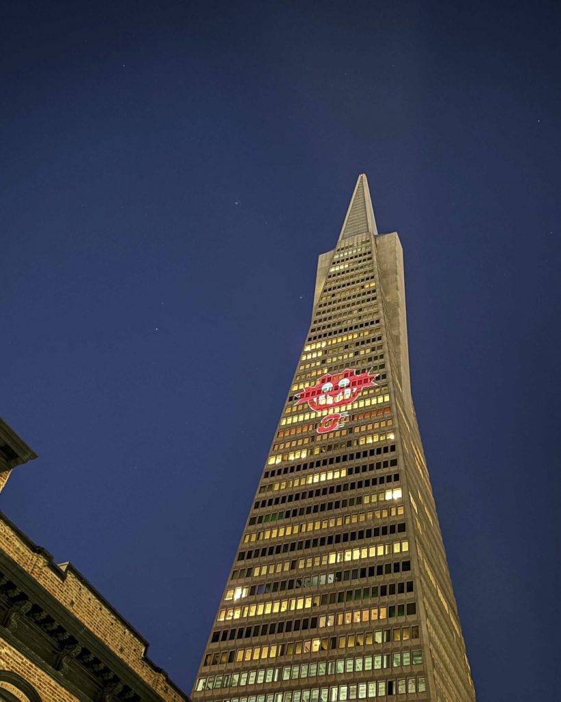 Sonic the Hedgehog 3 projections featuring images of Sonic, Shadow, and the classic Robotnik icon appear in multiple cities and locations around the world, as seen here at the TransAmerica Building, San Francisco.