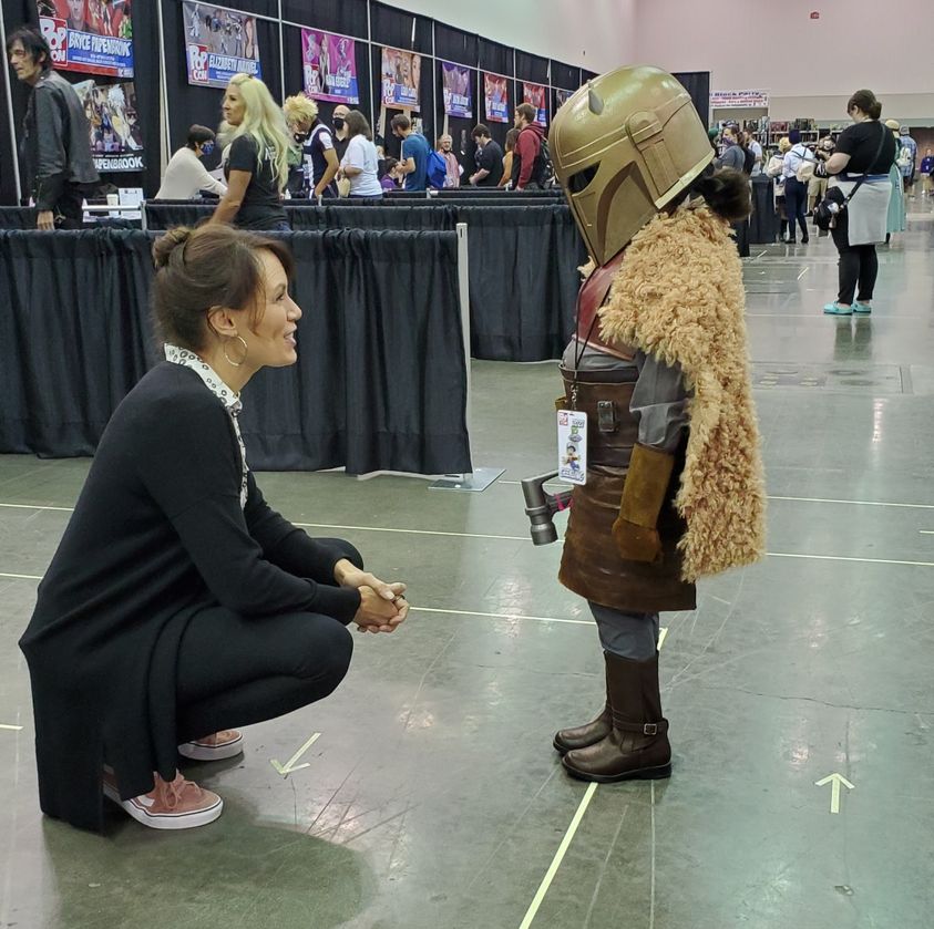 Emily Swallow with child armorer cosplayer